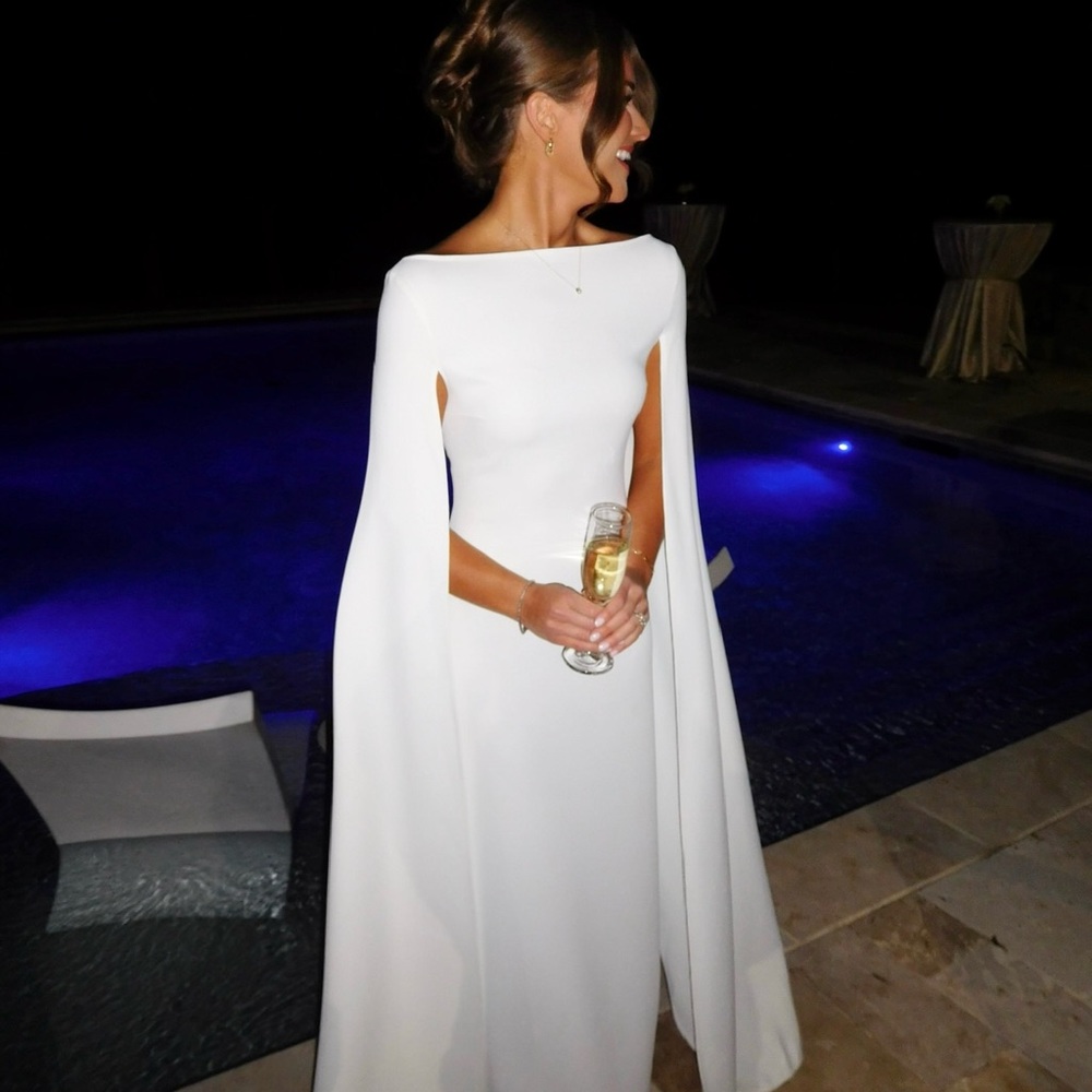 Solace London gown. Name of dress: The Sadie Maxi Dress in Cream.